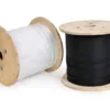 Two wooden spools of electrical wire on a white background white cable on the left and black cable on the right   wavetech solutions limited